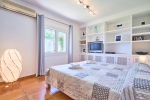 Postel nebo postele na pokoji v ubytování Villa Brusc