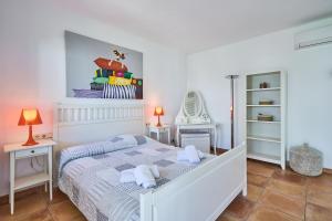Postel nebo postele na pokoji v ubytování Villa Brusc