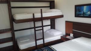 Postel nebo postele na pokoji v ubytování La Bocana de Quiximies Hotel