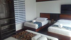 Postel nebo postele na pokoji v ubytování La Bocana de Quiximies Hotel