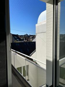 a view from a window of a building at City Center Studio-balcony at town hall in Basel