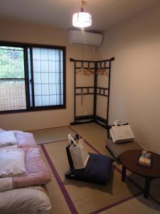 Postel nebo postele na pokoji v ubytování Guesthouse Engawa