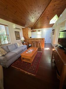 a living room with a couch and a table at The 1708 House in Southampton