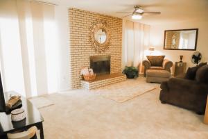 a living room with a couch and a fireplace at 3Br 2Ba Charming gem near shops, restaurants, and hospitals in Albuquerque