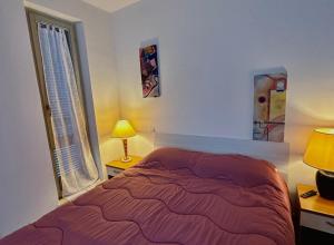 Postel nebo postele na pokoji v ubytování Casa vacanze Giuliani via Rasiglia