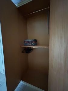 a small closet with a shelf in a room at CASA STALLONE in Bari +16 photos
