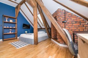 Posteľ alebo postele v izbe v ubytovaní Przytulny Apartament Z Wieżą