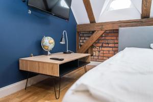 Posteľ alebo postele v izbe v ubytovaní Przytulny Apartament Z Wieżą