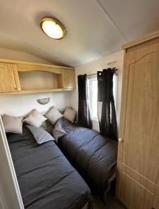 a room with two sleeping bags in a caravan at 2 Bedroom Caravan With Sea Views in Eastchurch