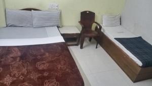 Katil atau katil-katil dalam bilik di MYSORE MAHALAKSHMI ROOMS
