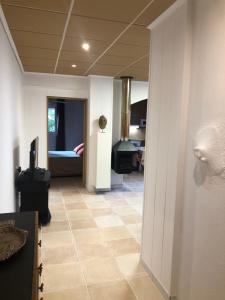 a hallway with a room with a bed in the background at Caballito de Mar in Roses +5 photos