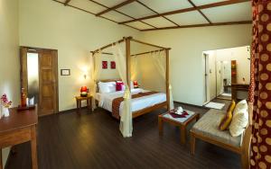 Postel nebo postele na pokoji v ubytování Neelakurunji Plantation Munnar + 29 fotografií