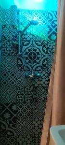 a bathroom with a black and white tile floor at Da Anna e Michele in Andria