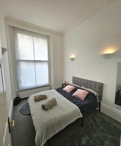 a bedroom with a bed with two pillows on it at Lovely One Bedroom Appartment in Marylebone Central London - 4 people in London