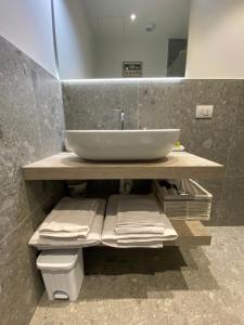 a bathroom with a sink and a toilet at La casa di Giò: piccolo gioiello in centro Como in Como