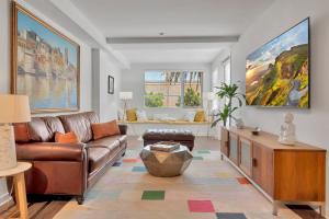 a living room with a couch and a table at 6 Modern 2 bdr apartment Santa Monica pier in Los Angeles