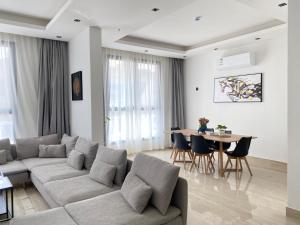 a living room with a couch and a table at شقق عبية الفندقية in Riyadh