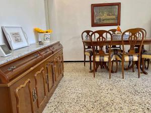 a dining room with a wooden table and chairs at Casa Aya in Teror