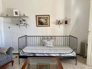 a couch in a living room with a glass table at Casa Aya in Teror
