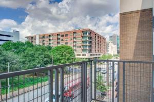 a balcony with a view of a building at Luxury Living Downtown Houston Kingbed. in Houston