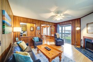 a living room with a couch and a table at Beech Mtn Condo w/ Slope View & Resort-Style Perks in Beech Mountain