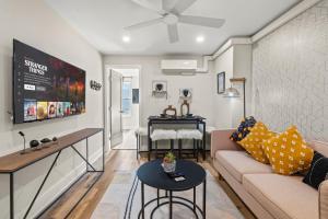 a living room with a couch and a table at 1 BR Passyunk Ave Stunner- Perfect Location in Philadelphia