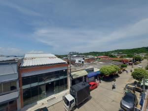 an aerial view of a city with a building at HOTEL LONDON Con Parqueadero in Aguachica