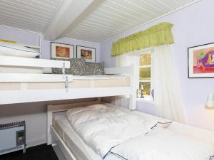 Postel nebo postele na pokoji v ubytování 4 person holiday home in Nykøbing M-By Traum