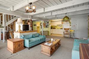 a living room with a couch and a table at Fishing Paradise on 160 Acres about 13 Mi to Saratoga in Saratoga +37 photos
