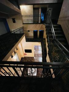 an overhead view of a staircase in a building at Hotel La Ane in Babadau