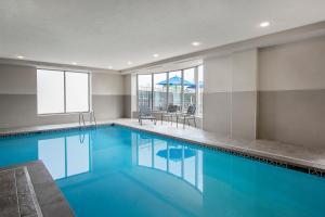 a swimming pool with blue water in a building at Hilton Garden Inn Cleveland Downtown in Cleveland