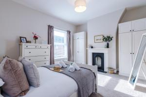 a bedroom with a bed and a fireplace at Central 2-bed home in Chester by 53 Degrees Property - Amazing location, Ideal for Couples - Sleeps 4! in Chester