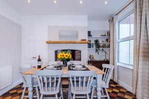 a dining room with a wooden table and chairs at Central 2-bed home in Chester by 53 Degrees Property - Amazing location, Ideal for Couples - Sleeps 4! in Chester