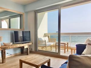 a living room with a view of the ocean at Vue sur mer La Baule Clara in La Baule