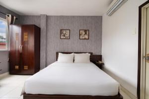 Postel nebo postele na pokoji v ubytování Sen Sai Gon Hotel - Ben Thanh Market