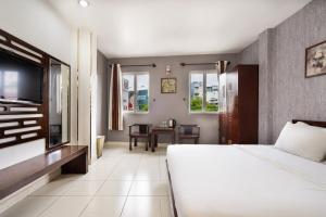 Postel nebo postele na pokoji v ubytování Sen Sai Gon Hotel - Ben Thanh Market + 26 fotografií
