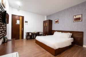 Postel nebo postele na pokoji v ubytování Sen Sai Gon Hotel - Ben Thanh Market