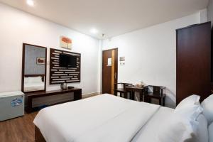 Postel nebo postele na pokoji v ubytování Sen Sai Gon Hotel - Ben Thanh Market