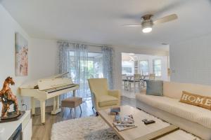 a living room with a couch and a piano at Largo House with Backyard Oasis and Proximity to Beach in Largo