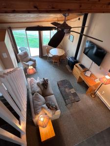 a living room with a couch and a table at Shorewater Resort in Qualicum Beach