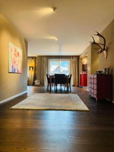 a dining room with a dining table and a dining roomiasm at Stunning Luxury apartment in Central Klosters in Klosters