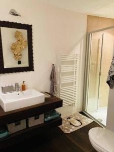 a bathroom with a white sink and a toilet at Stunning Luxury apartment in Central Klosters in Klosters