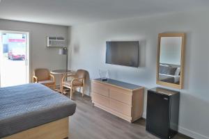 Μια τηλεόραση ή/και κέντρο ψυχαγωγίας στο Motel Mascouche +20 φωτογραφίες