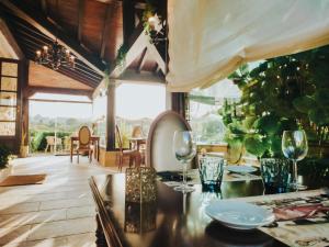 a dining room with a table with glasses on it at Posada Spa San Marcos in Santillana del Mar