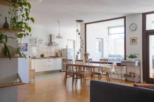 a kitchen and dining room with a table and chairs at Family apartment in the city centre - FREE parking garage in Ljubljana