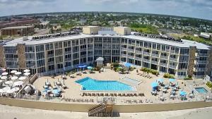 an aerial view of a resort with a swimming pool at Ocean East Resort Club in Ormond Beach
