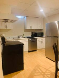 A kitchen or kitchenette at Finished 2 BR Apartment in an Upscale Area of Ajax
