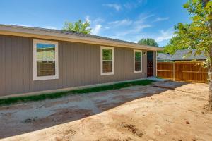 a house with a dirt driveway in front of it at Game Room and Walk to Beach Gun Barrel City Gem! in Gun Barrel City