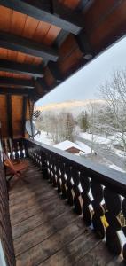 a balcony with a view of a snow covered field at Manu's Ferienwohnung in Schluchsee