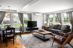 a living room with a couch and a table at Equinox Resort Residences in Manchester